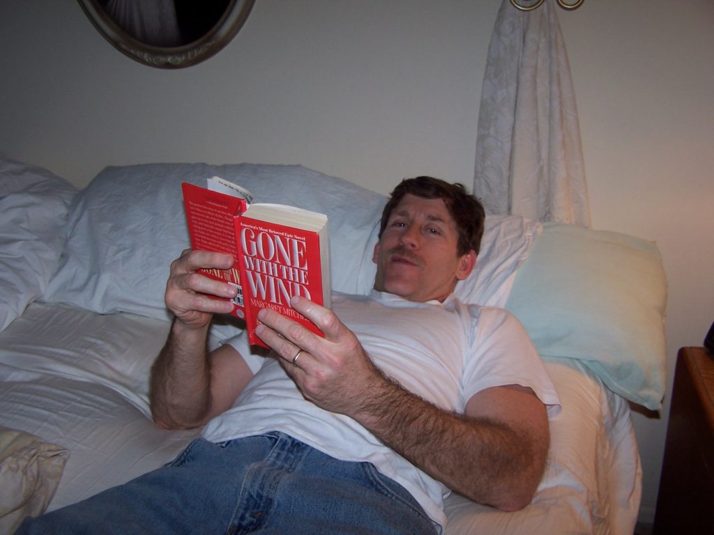 Man reading Gone with the Wind